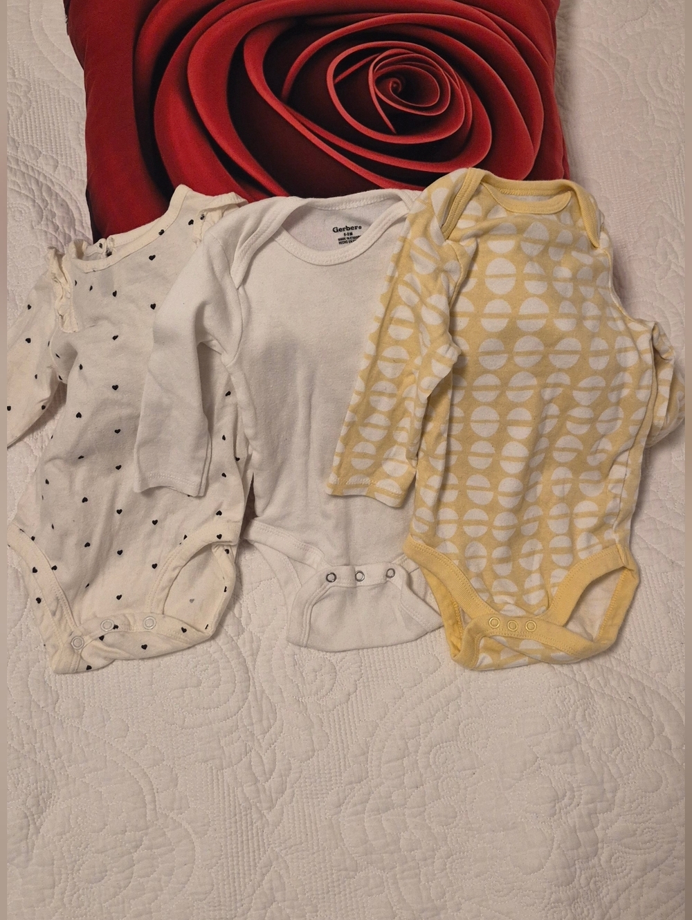 Gerber White Long-Sleeve Baby Onesie + Two Neutral Patterned Bodysuits